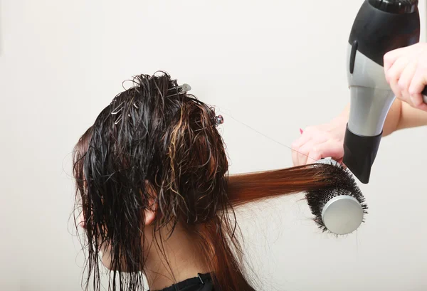 Hairstylist drying hair woman client in hairdressing beauty salon — Stock Photo, Image