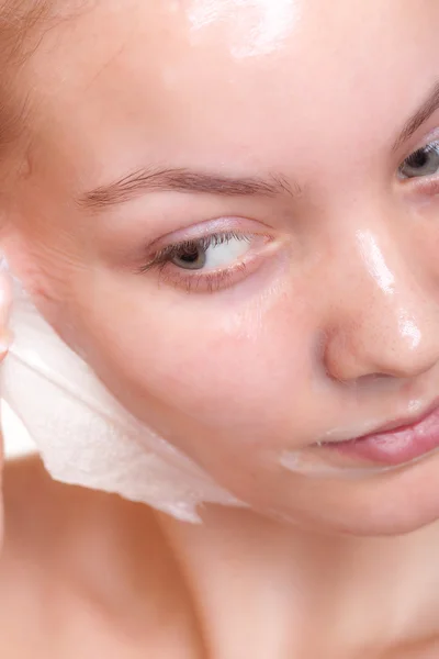 Woman in facial peel off mask. — Stock Photo, Image