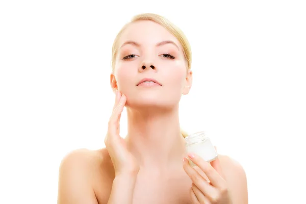 Girl applying moisturizing cream — Stock Photo, Image