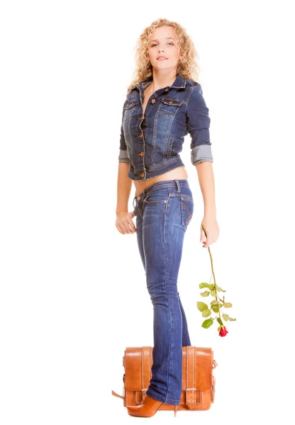 Full length student girl in blue jeans bag holds red rose — Stock Photo, Image