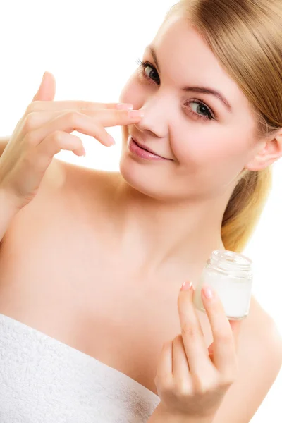 Girl applying moisturizing cream. — Stock Photo, Image