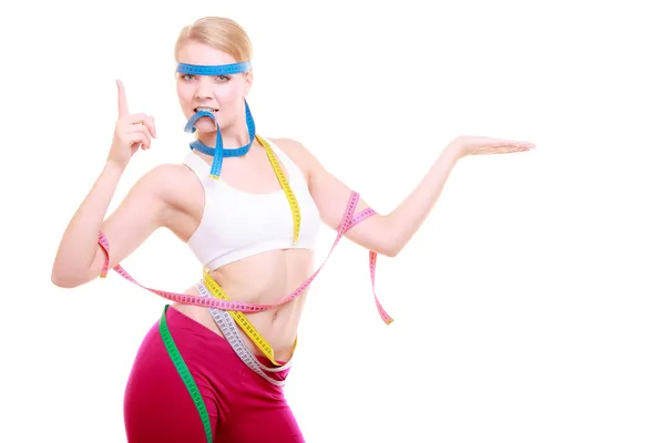 Mujer fitness obsesionada con un montón de cintas de medición de colores —  Fotos de Stock