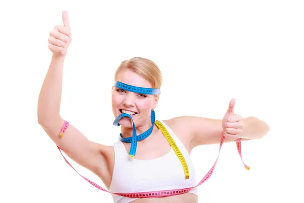 Obsessed fitness woman with a lot of colorful measure tapes — Stock Photo, Image