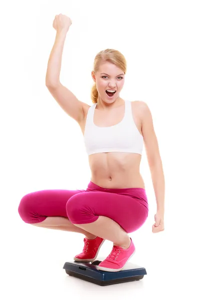 Fitness woman on weight scale — Stock Photo, Image