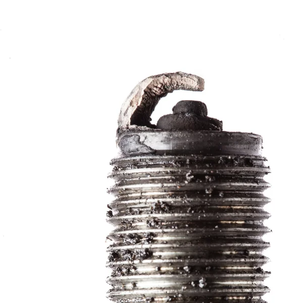 Auto service. Old spark plug as spare part of car. — Stock Photo, Image