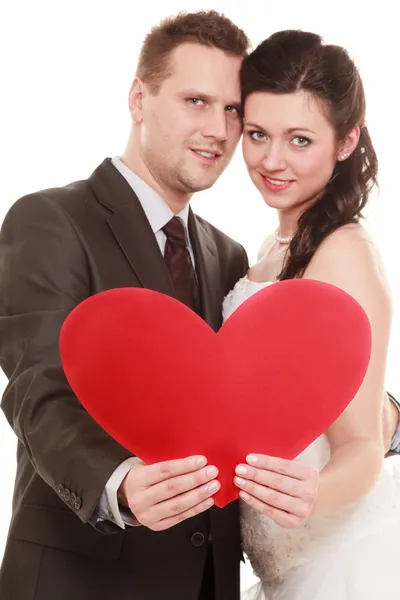 Bride and groom holding heart love — Stock Photo, Image