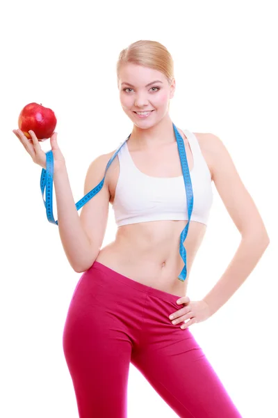 Fitness woman fit girl with measure tape and apple fruit — Stock Photo, Image