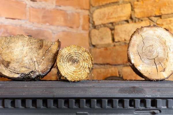 Winter at home. Firewood on the metal stove fireplace. Heating. — Stock Photo, Image