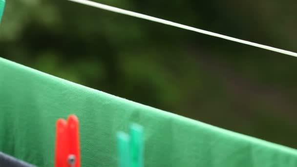Clothes drying on the rope outdoors — Stock Video