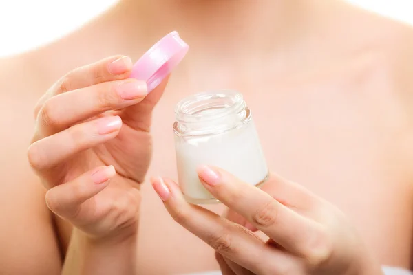 Girl applying moisturizing cream. — Stock Photo, Image