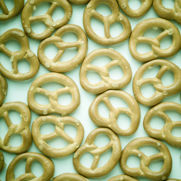 Salted pretzels on white as food background — Stock Photo, Image