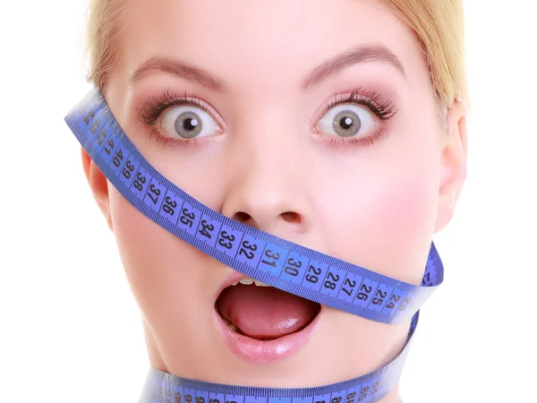 Obsessed girl with violet measure tapes around her head — Stock Photo, Image