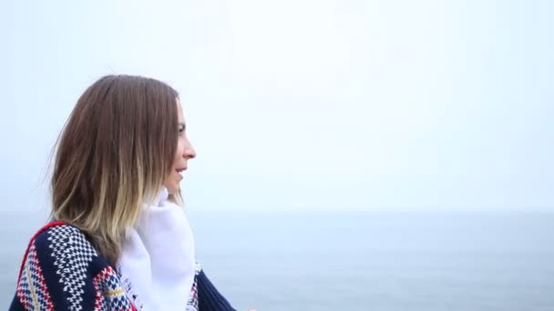 Woman on the shore waving and rejoices — Stock Video