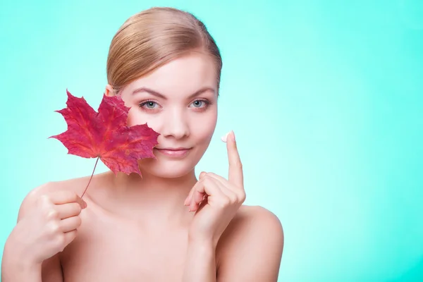 Face of young woman girl with red maple leaf. — Stock Photo, Image