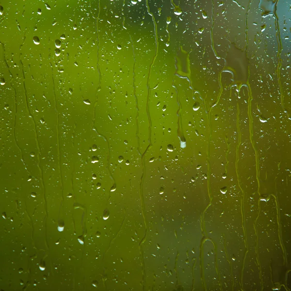 Fechar-se de gotas de água no vidro como fundo — Fotografia de Stock