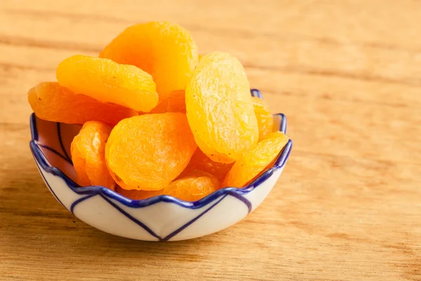 Bowl of dried apricots — Stock Photo, Image