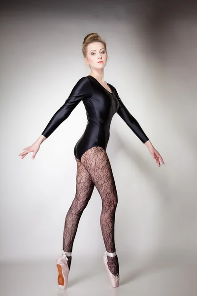 Modern style woman ballet dancer full length on gray — Stock Photo, Image