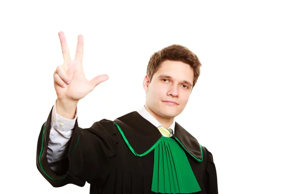 Man lawyer in polish gown counting on fingers — Stock Photo, Image