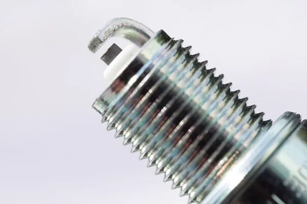 New spark plug as spare part of car. — Stock Photo, Image