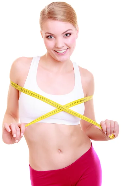 Fitness womanwith measure tape measuring her bust — Stock Photo, Image