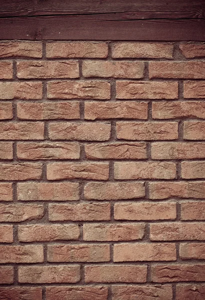 Brick wall with wooden beam background — Stock Photo, Image