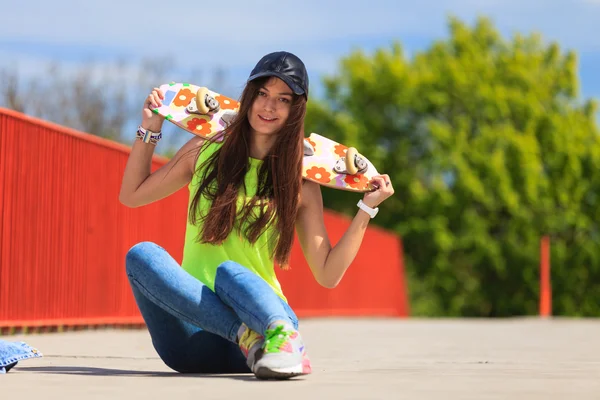 Cool girl skater with skateboard — Stock Photo, Image