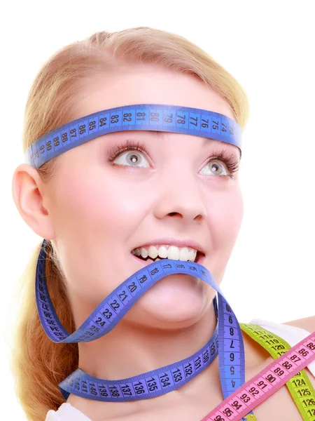 Obsessed girl with violet measure tapes around her head — Stock Photo, Image