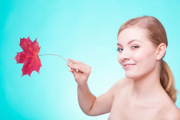 Portrait of young woman  with red maple leaf. — Stock Photo, Image