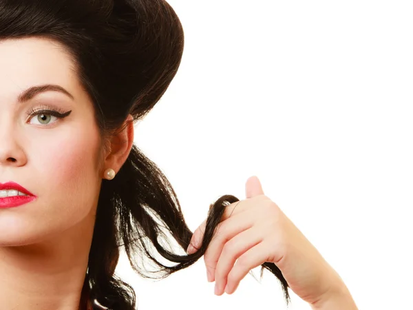 Coquette pinup girl playing with hair — Stock Photo, Image