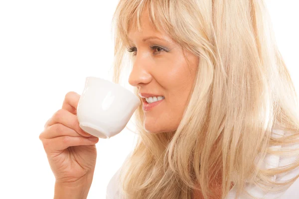 Mature woman drinking tea or coffee — Stock Photo, Image