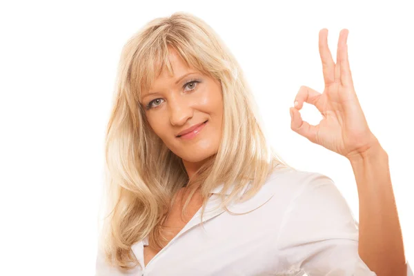 Mature woman showing ok sign hand gesture isolated — Stock Photo, Image