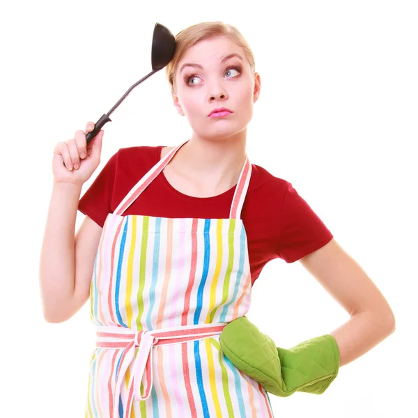 Funny housewife or cook chef in colorful kitchen apron with ladle — Stock Photo, Image