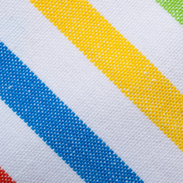 Primer plano del textil a rayas de colores como fondo o textura — Foto de Stock