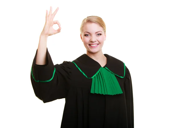 Právník v polštině šaty ukazující ok — Stock fotografie