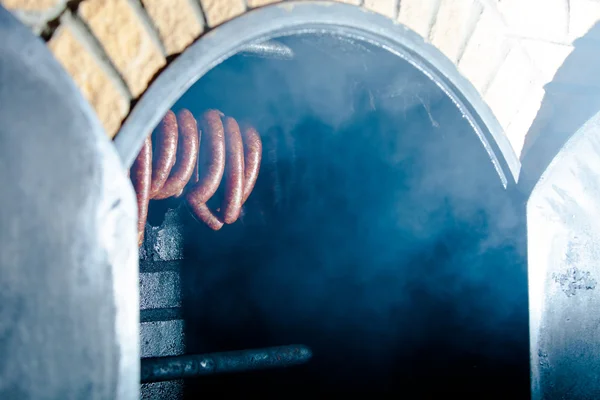 Sausages in smokehouse — Stock Photo, Image