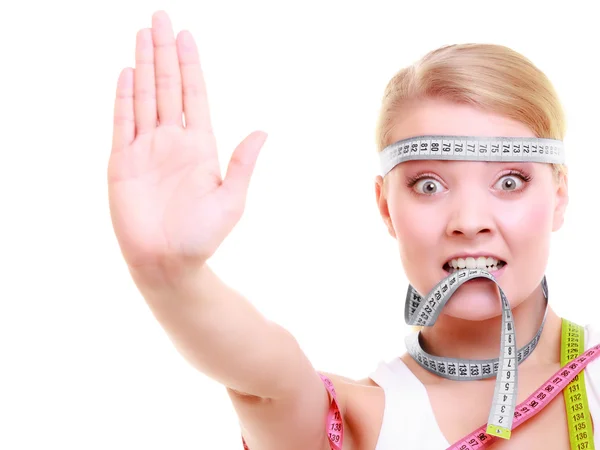 Woman with a lot of measure tapes — Stock Photo, Image