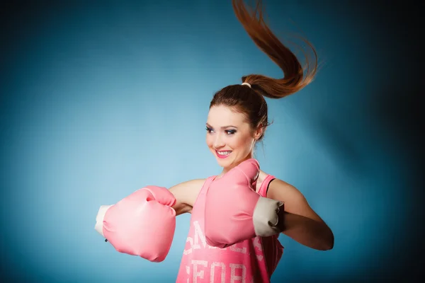 Female boxer wearing big fun pink gloves playing sports — Stock Photo, Image