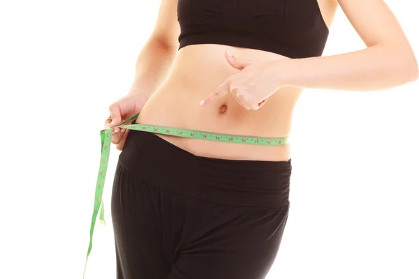 Diet. slim fit girl with measure tape measuring waist — Stock Photo, Image