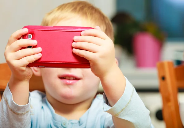 Happy childhood. Blond boy kid child playing with mobile phone — Stock Photo, Image