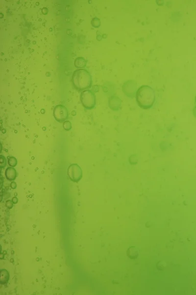 Soap bubbles green liquid background — Stock Photo, Image