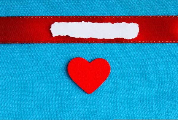Valentines day background. paper blank heart on blue fabric material Stock Photo