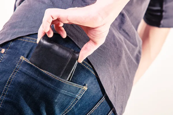 Closeup. Thief stealing wallet from back pocket of man. Theft. — Stock Photo, Image