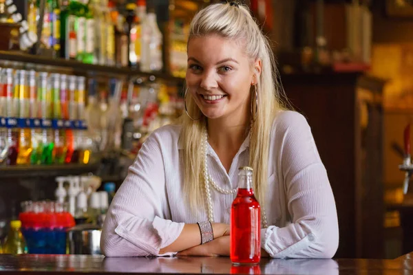 Woman Working Bar Counter Holding Red Bottle Lemonade — Stock Photo, Image