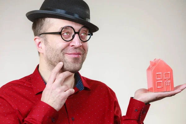 Adult Man Wearing Funny Hat Eyeglasses Holding Small Red House — Stock Photo, Image