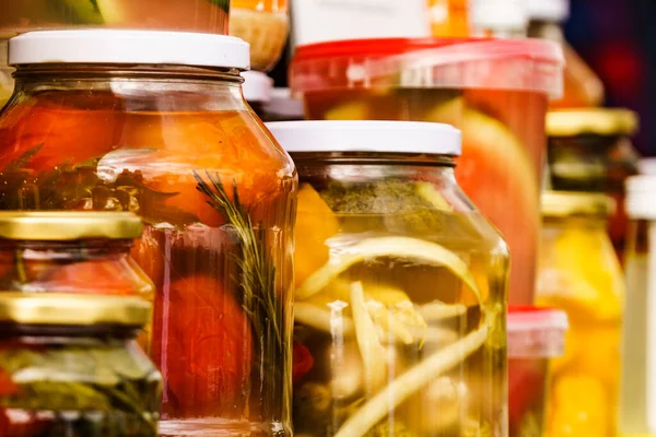 Food preserving for autumn winter time. Jars with pickled vegetables. Food fermentation.