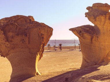 Stunning rock erosion formations along beach in Bolnuevo, near Mazarron. Natural sandstone shapes. Murcia Spain. Places to visit. Tourist attraction. clipart