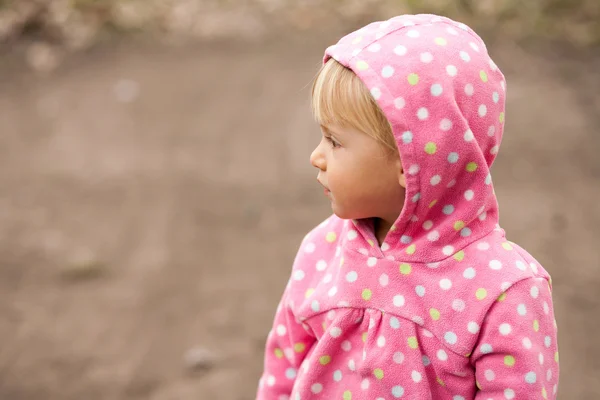 Profile of a little girl in a hood — Stock Photo, Image