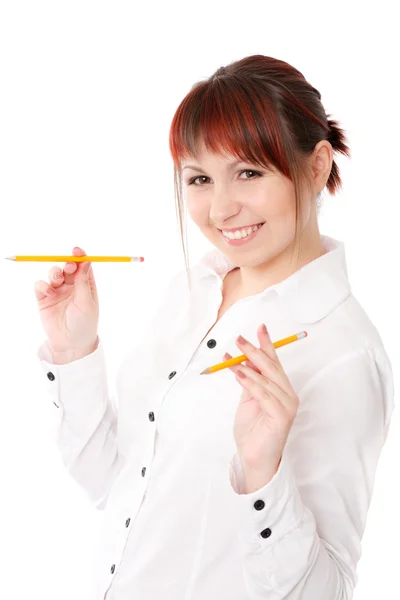 Ung kvinna leker med två pennor Stockfoto