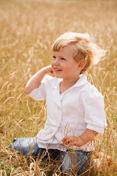 Little girl sit on her knees — Stock Photo, Image