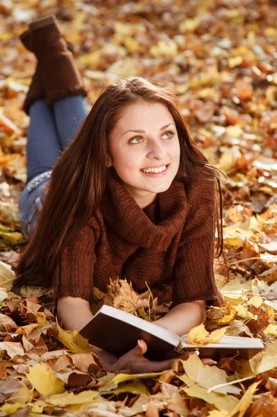 Young female reading book Stock Picture